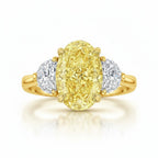 My Store 4 18K solid gold trilogy ring featuring a fancy yellow oval lab-grown diamond flanked by two side diamonds.