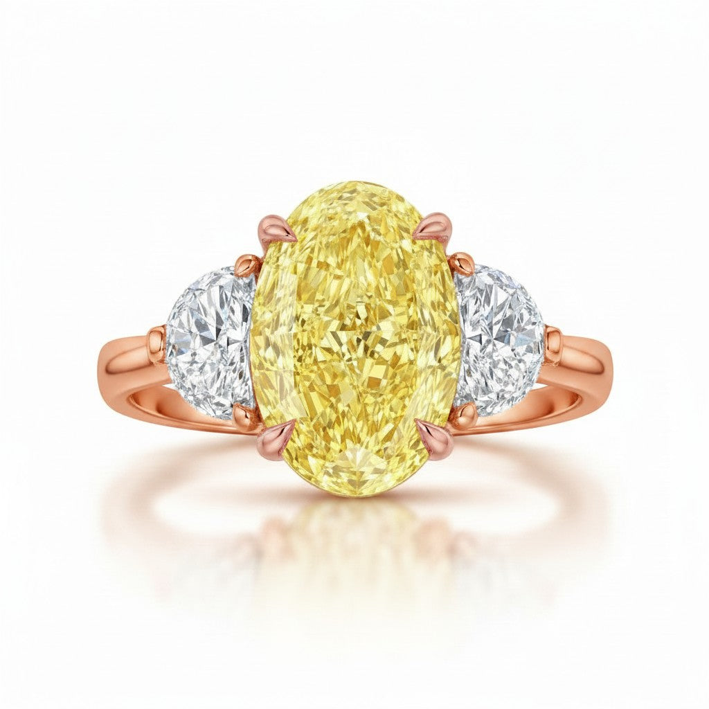 My Store 4 18K solid gold trilogy ring featuring a fancy yellow oval lab-grown diamond flanked by two side diamonds.