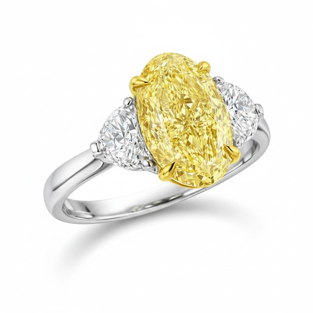 My Store 4 18K gold trilogy ring featuring a fancy yellow oval lab-grown diamond flanked by two side diamonds.