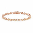 My Store 4 fancy yellow pear cut diamond tennis bracelet in rose gold with articulated links and secure box clasp.