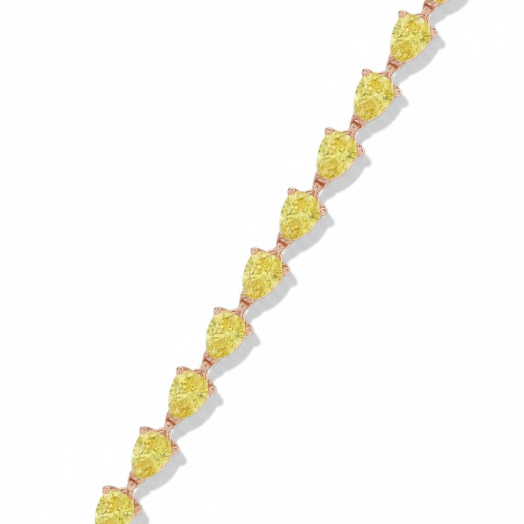 My Store 4 fancy yellow pear-cut diamond tennis bracelet in a gold 3-prong setting on a white background.