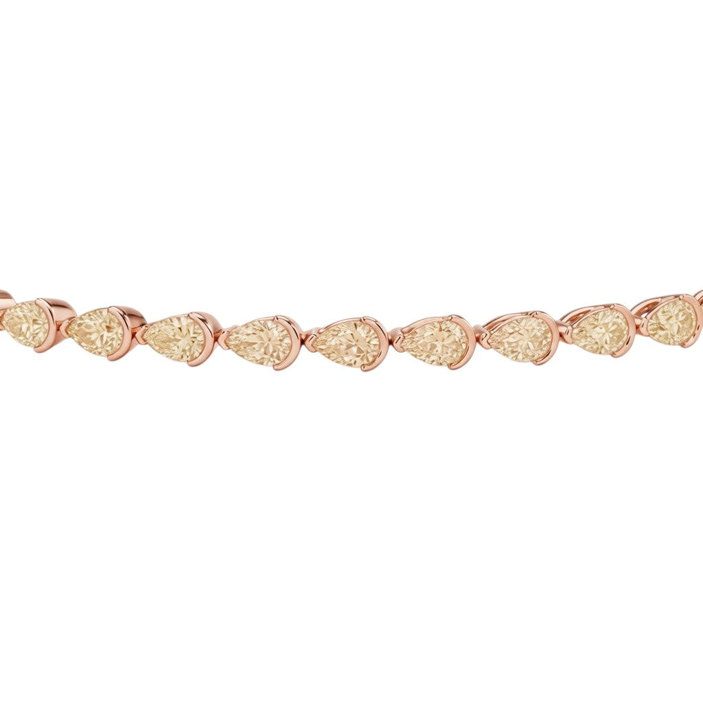 My Store 4 fancy yellow pear-cut diamond tennis bracelet in rose gold with half-bezel settings on a white background.