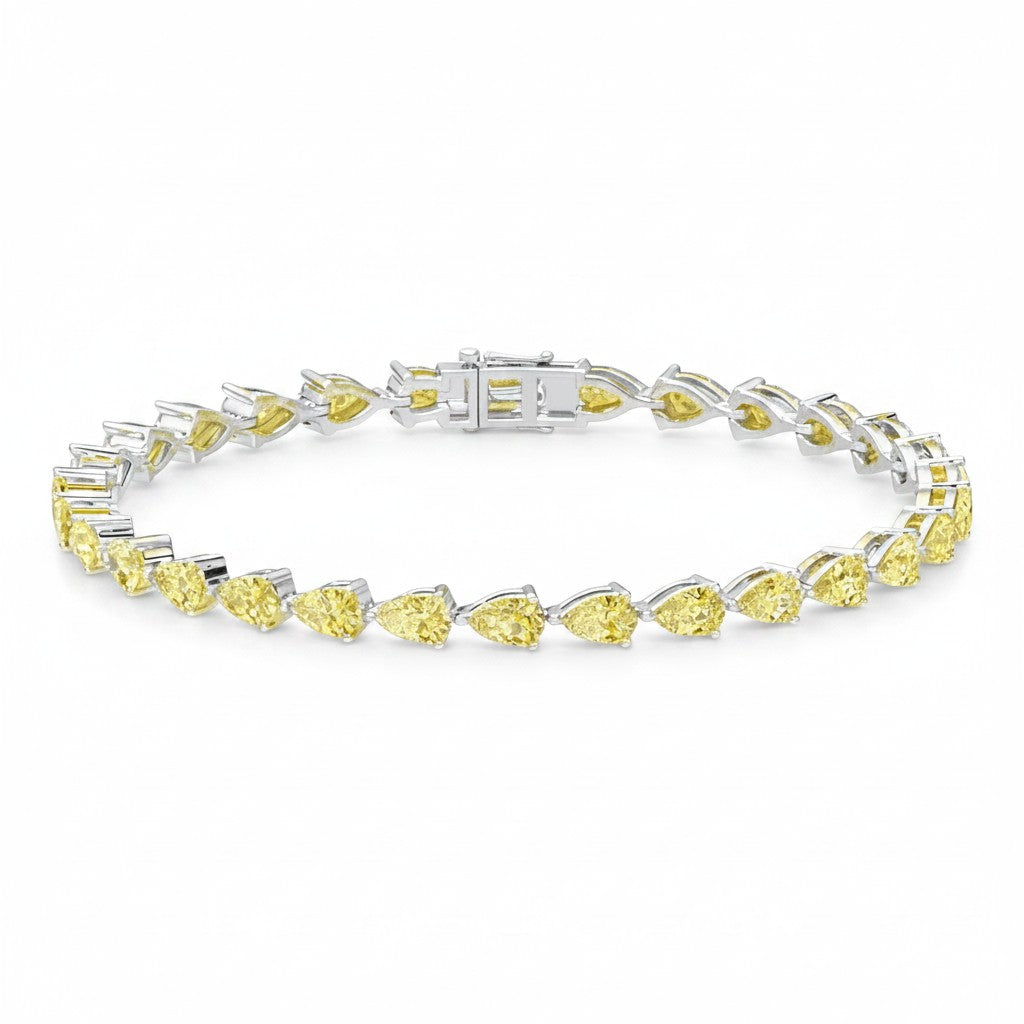 My Store 4 luxury tennis bracelet featuring a continuous line of fancy yellow pear-cut diamonds in gold settings.