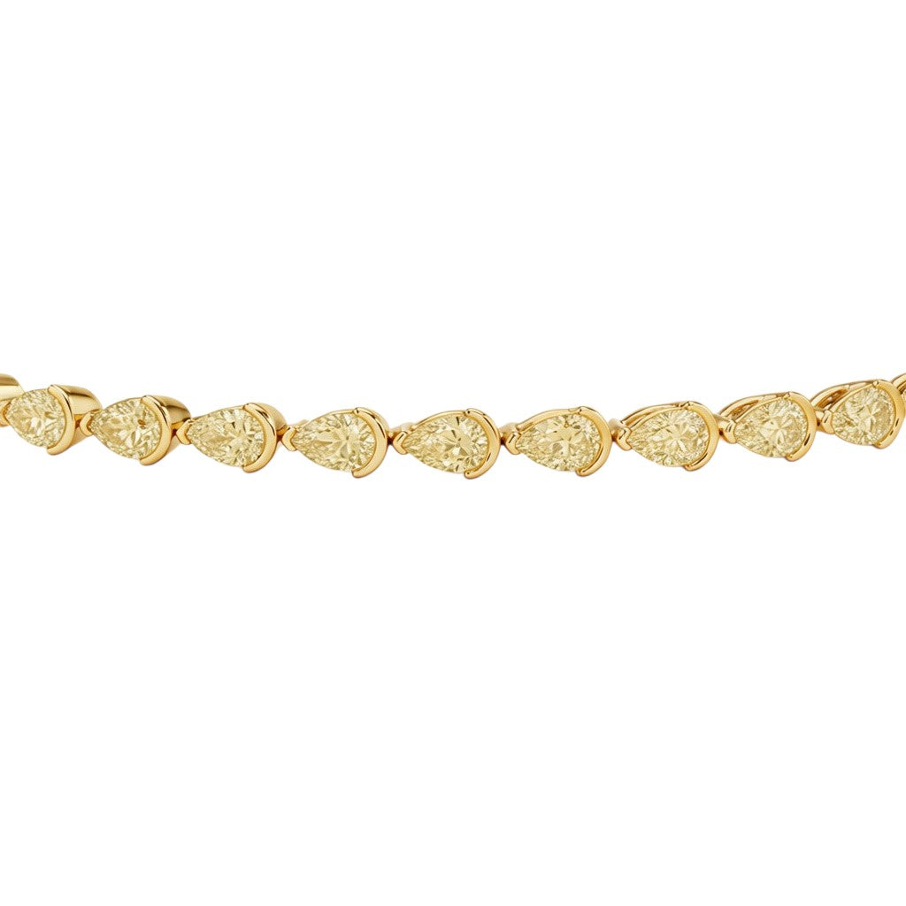 My Store 4 tennis bracelet featuring fancy yellow pear-cut diamonds in solid gold half-bezel settings.
