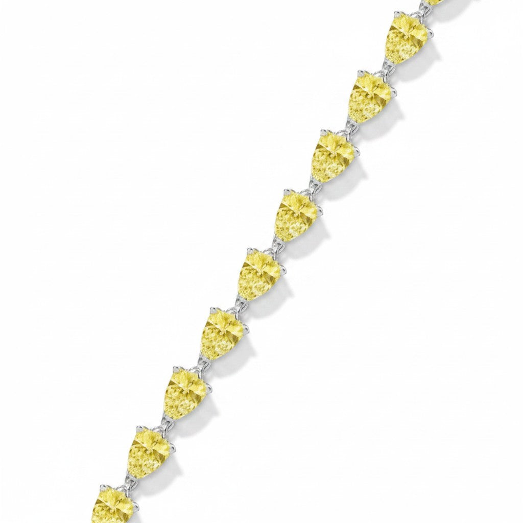 My Store 4 fancy yellow pear-cut diamond tennis bracelet in a continuous tip-to-end gold setting.