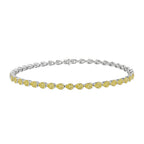 My Store 4 tennis bracelet featuring fancy yellow pear-cut diamonds in white gold half-bezel settings.