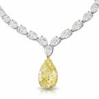 My Store 4 bridal necklace featuring a fancy yellow pear-cut diamond drop suspended from a white pear-cut diamond strand.