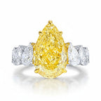 My Store 4 18K gold ring featuring a large pear-cut fancy yellow lab diamond flanked by smaller white pear diamonds.