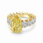 My Store 4 18K gold ring featuring a large fancy yellow pear-cut lab diamond surrounded by smaller pear-cut diamonds.
