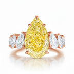 My Store 4 18K solid gold engagement ring featuring a large pear-cut fancy yellow lab diamond with side stone accents.