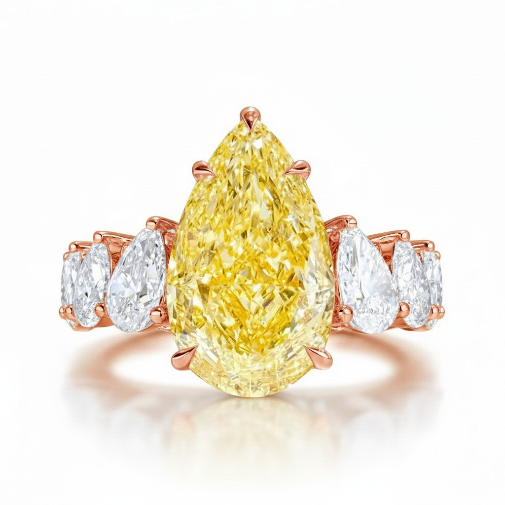 My Store 4 18K solid gold engagement ring featuring a large pear-cut fancy yellow lab diamond with side stone accents.