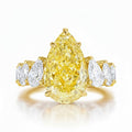 My Store 4 18K solid gold engagement ring featuring a fancy yellow pear-cut lab diamond with side accent stones.