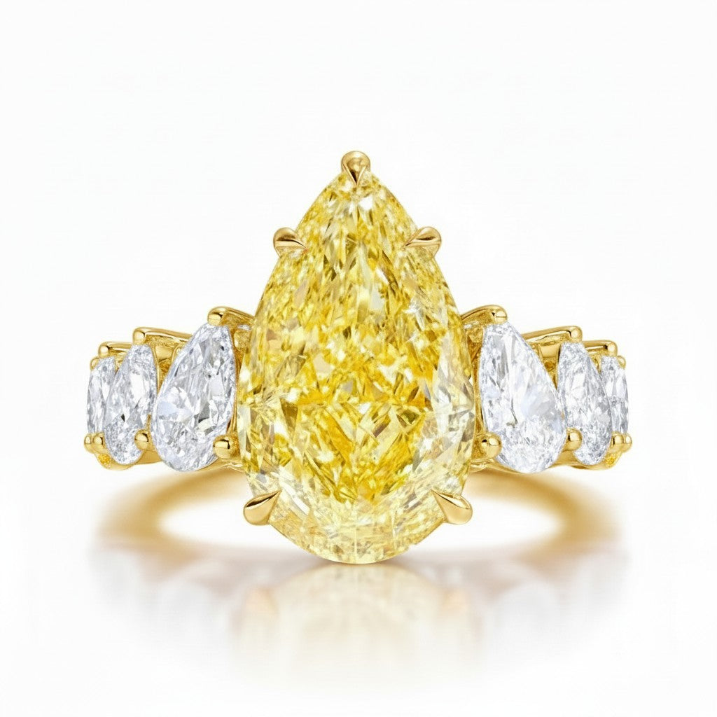 My Store 4 18K solid gold engagement ring featuring a fancy yellow pear-cut lab diamond with side accent stones.
