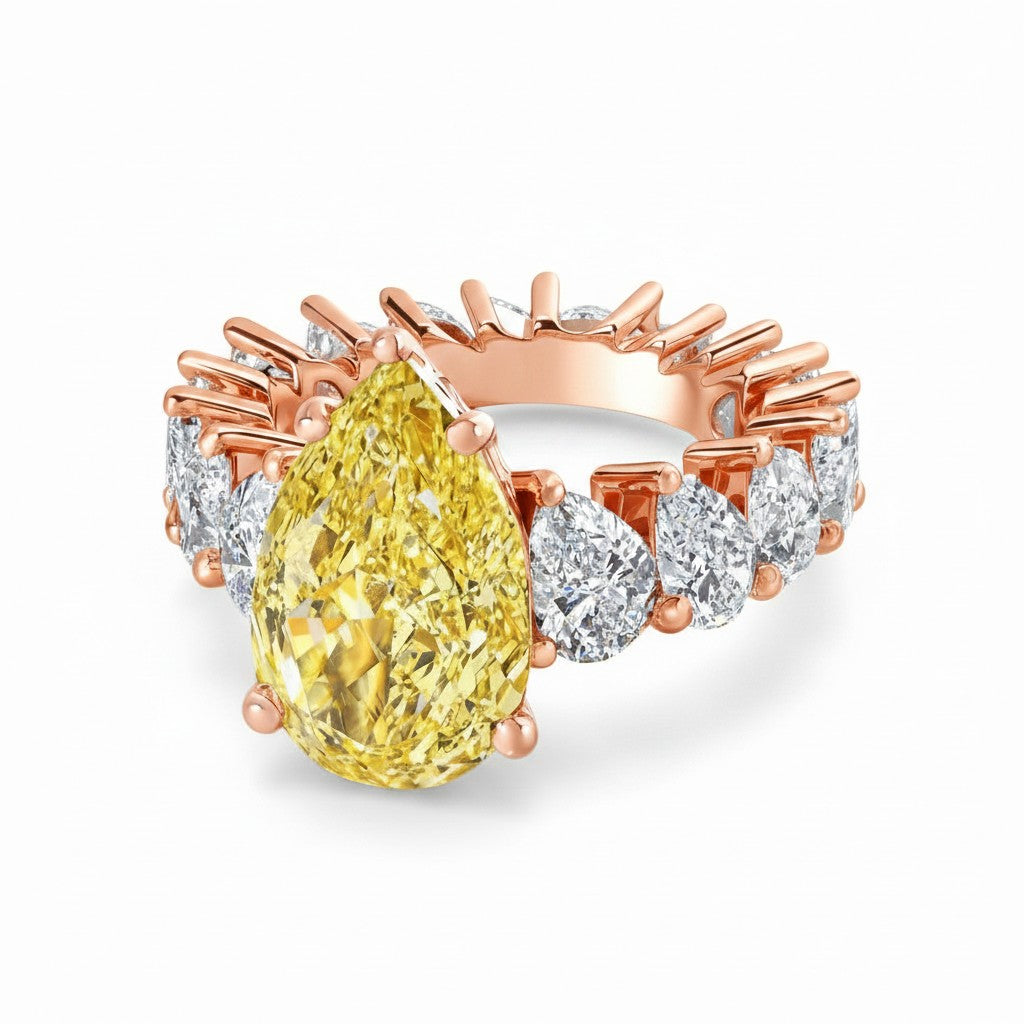 My Store 4 18K solid gold ring featuring a fancy yellow pear-cut lab diamond with white pear-cut diamond side stones.