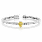 My Store 4 tennis bracelet featuring a central fancy yellow pear-cut diamond surrounded by round white diamonds in gold.