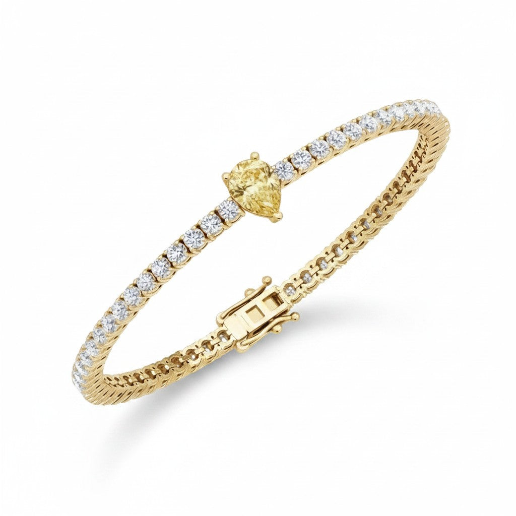 My Store 4 tennis bracelet featuring a central fancy yellow pear-cut diamond surrounded by round white diamonds in gold.