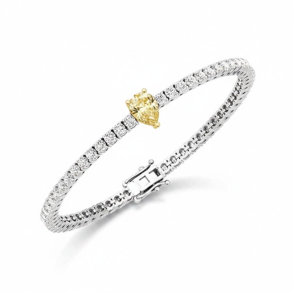 My Store 4 tennis bracelet featuring a central fancy yellow pear-cut diamond surrounded by round white diamonds in gold.