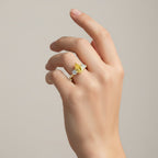My Store 4 18K solid gold trilogy ring featuring a fancy yellow pear-cut lab diamond on a woman's hand