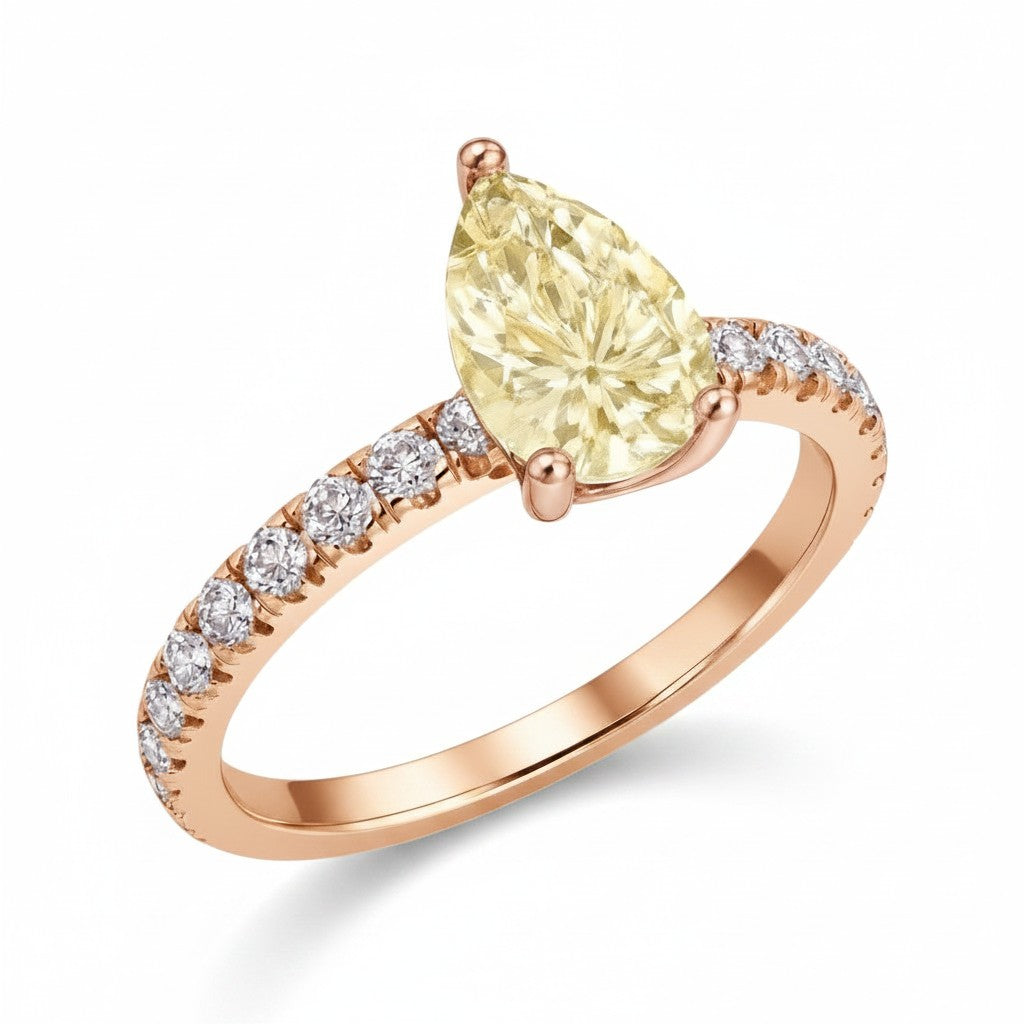 My Store 4 18K solid gold ring featuring a fancy yellow pear-cut diamond with pavé-set side diamonds.