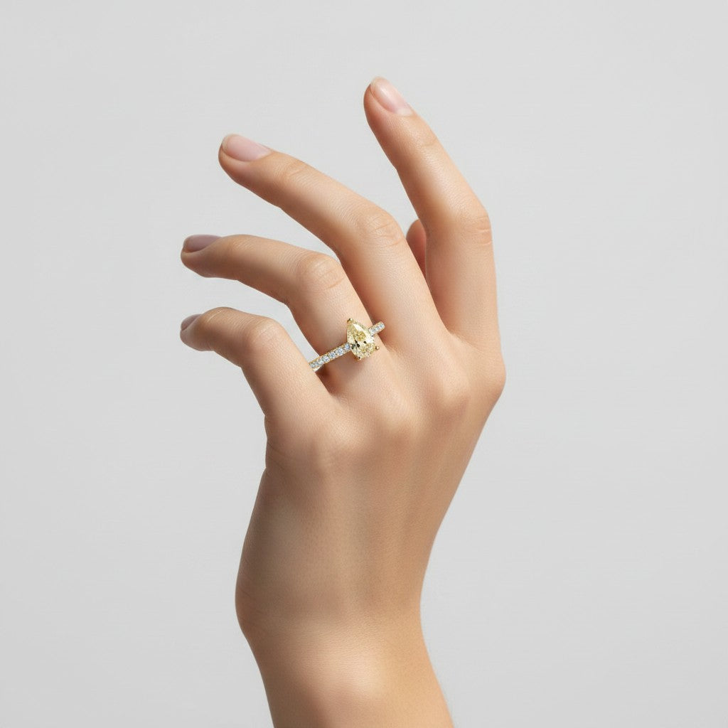 My Store 4 18K solid yellow gold ring featuring a pear-cut fancy yellow diamond with pavé-set diamonds on a hand