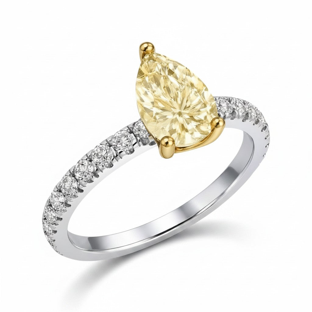 My Store 4 18K gold ring featuring a fancy yellow pear-cut diamond with pavé-set diamonds on a white gold band.