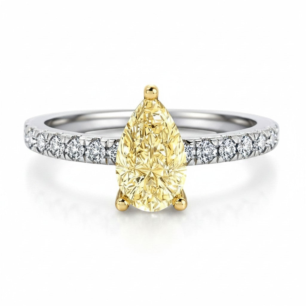 My Store 4 18K gold ring featuring a fancy yellow pear-cut diamond with pavé-set diamonds on a white gold band.