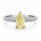 My Store 4 18K gold ring featuring a fancy yellow pear-cut diamond with pavé-set diamonds on a white gold band.