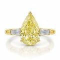 My Store 4 18K solid gold trilogy ring featuring a pear-cut fancy yellow diamond flanked by baguette-cut diamonds.