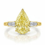 My Store 4 18K solid gold trilogy ring featuring a pear-cut fancy yellow diamond flanked by baguette-cut diamonds.
