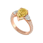 My Store 4 18K solid gold trilogy ring featuring a fancy yellow pear-cut lab diamond and diamond-encrusted band