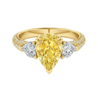 My Store 4 18K solid gold trilogy ring featuring a fancy yellow pear-cut lab diamond with side stones and pavé band.