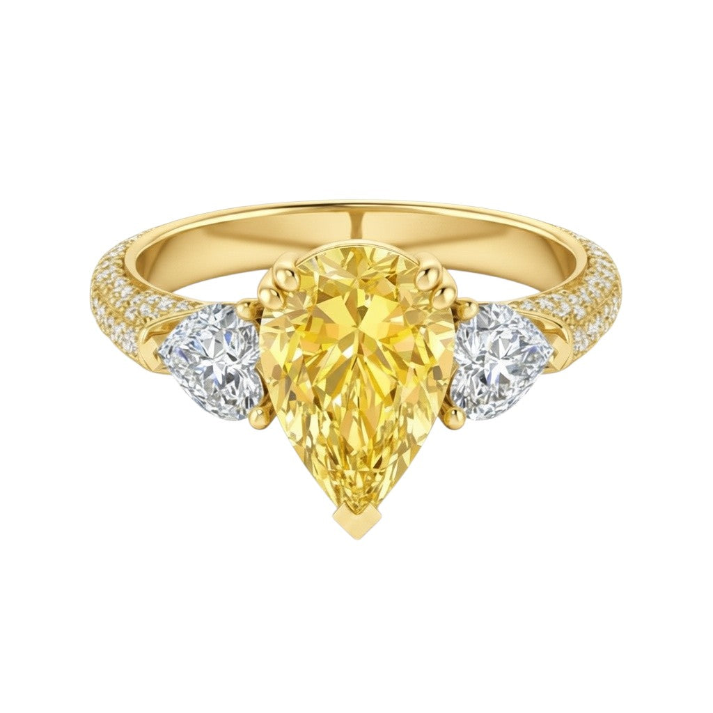 My Store 4 18K solid gold trilogy ring featuring a fancy yellow pear-cut lab diamond with side stones and pavé band.