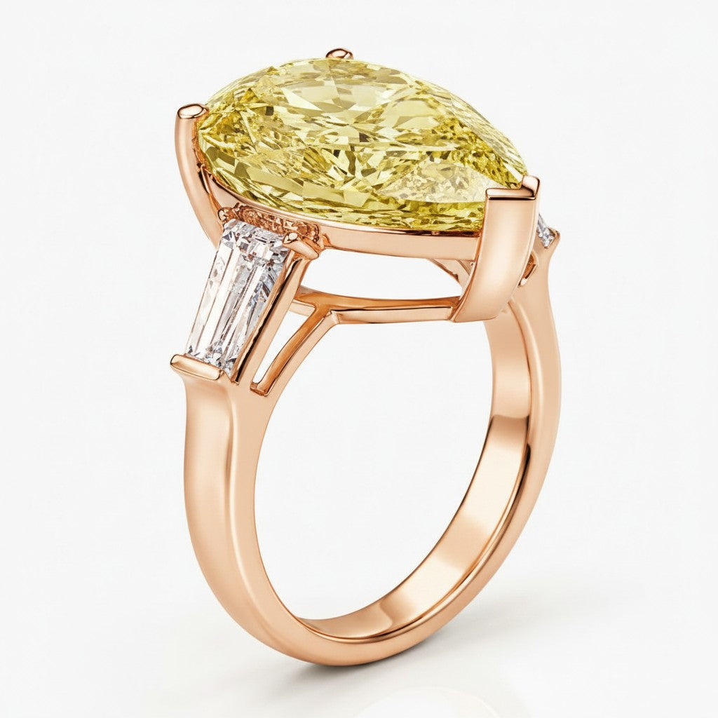 My Store 4 18K solid gold trilogy ring featuring a pear-cut fancy yellow diamond and baguette side diamonds.