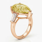 My Store 4 18K solid gold trilogy ring featuring a pear-cut fancy yellow diamond and baguette side diamonds.
