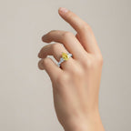 My Store 4 18K gold trilogy ring featuring a fancy yellow pear-cut lab diamond on a woman's hand