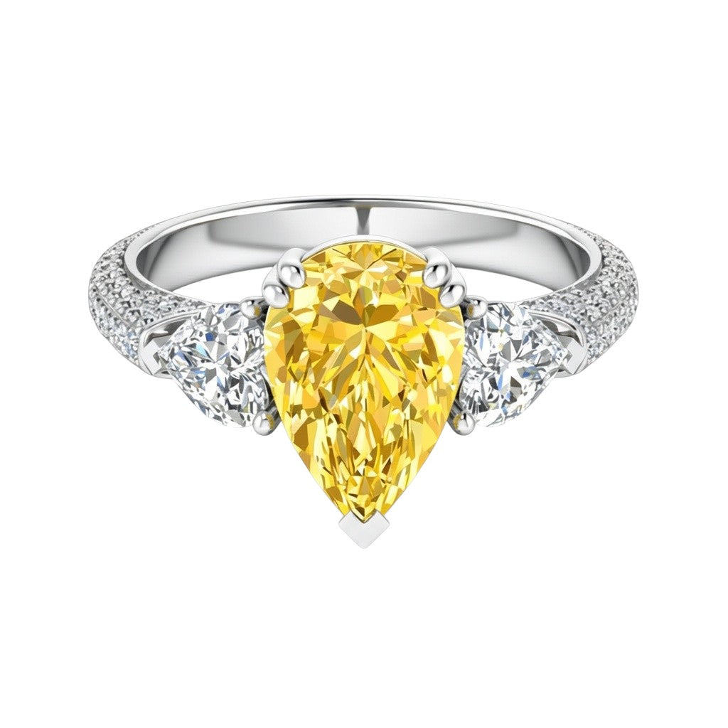 My Store 4 18K gold trilogy ring featuring a fancy yellow pear-cut lab diamond flanked by two side diamonds.