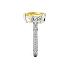 My Store 4 18K solid gold trilogy ring featuring a fancy yellow pear-cut lab diamond with pavé diamond band