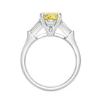My Store 4 18K gold trilogy ring featuring a pear-cut yellow diamond centerpiece and baguette side diamonds.