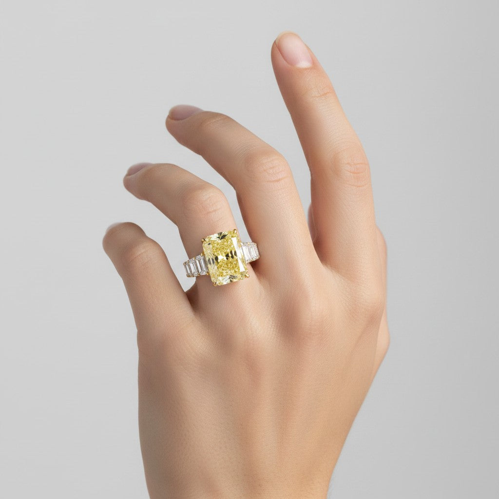My Store 4 18K solid gold engagement ring featuring a radiant-cut fancy yellow lab-grown diamond on a woman's hand.