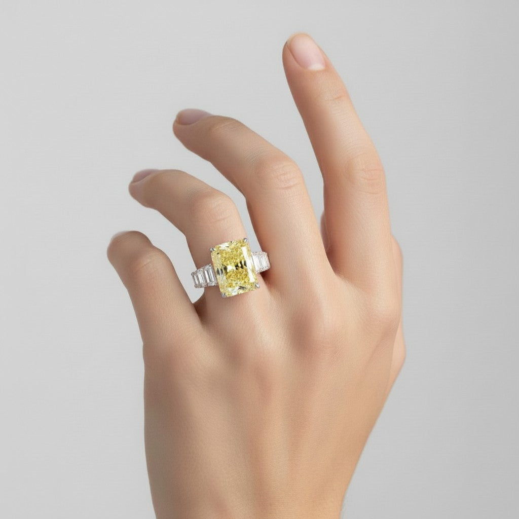 My Store 4 18K solid gold ring featuring a radiant-cut fancy yellow lab-grown diamond on a woman's hand.