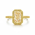 My Store 4 18K solid gold radiant-cut fancy yellow lab diamond ring with a pavé halo setting on a white background.