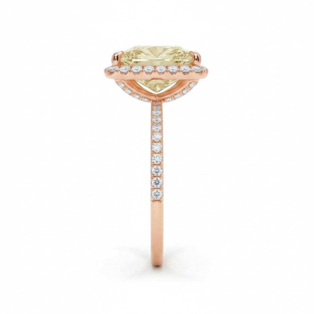 My Store 4 18K solid gold ring featuring a fancy yellow radiant-cut diamond in a sparkling halo setting, side view.