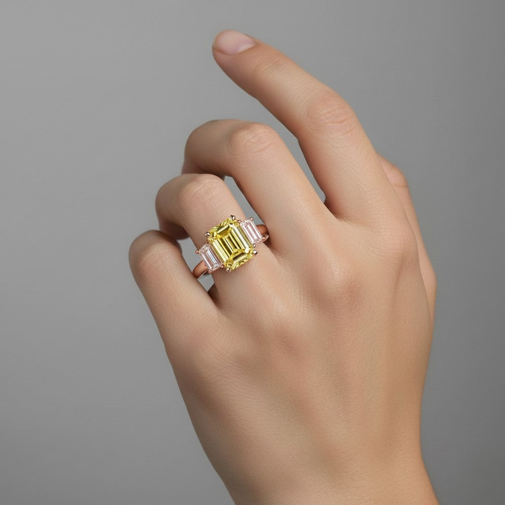 My Store 4 18K gold trilogy ring featuring a radiant-cut fancy yellow lab diamond on a hand.