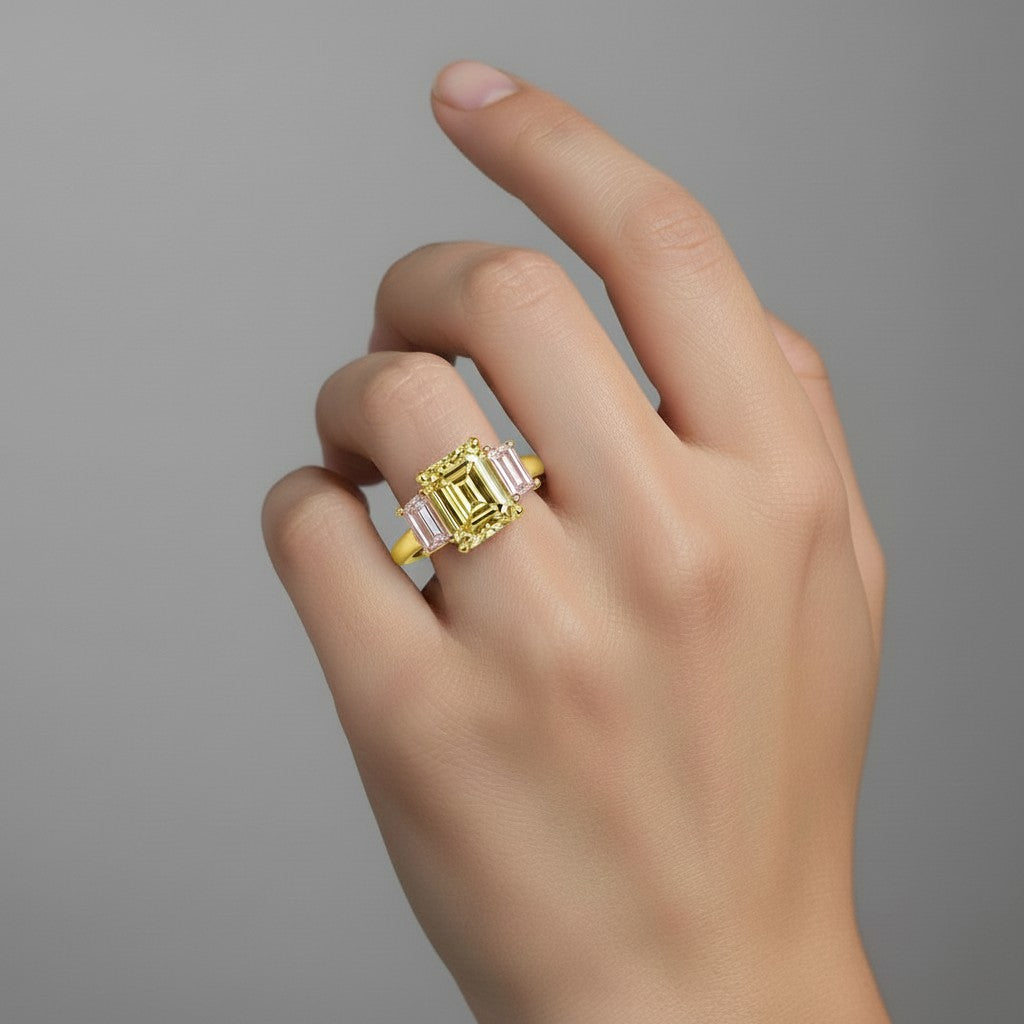My Store 4 18K solid gold trilogy ring featuring a radiant-cut fancy yellow lab diamond on a woman's finger