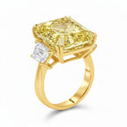 My Store 4 18K gold trilogy ring featuring a radiant-cut fancy yellow lab-grown diamond with side stones.