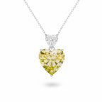 My Store 4 pendant necklace featuring a large fancy yellow heart-cut diamond drop suspended from a white heart diamond bail