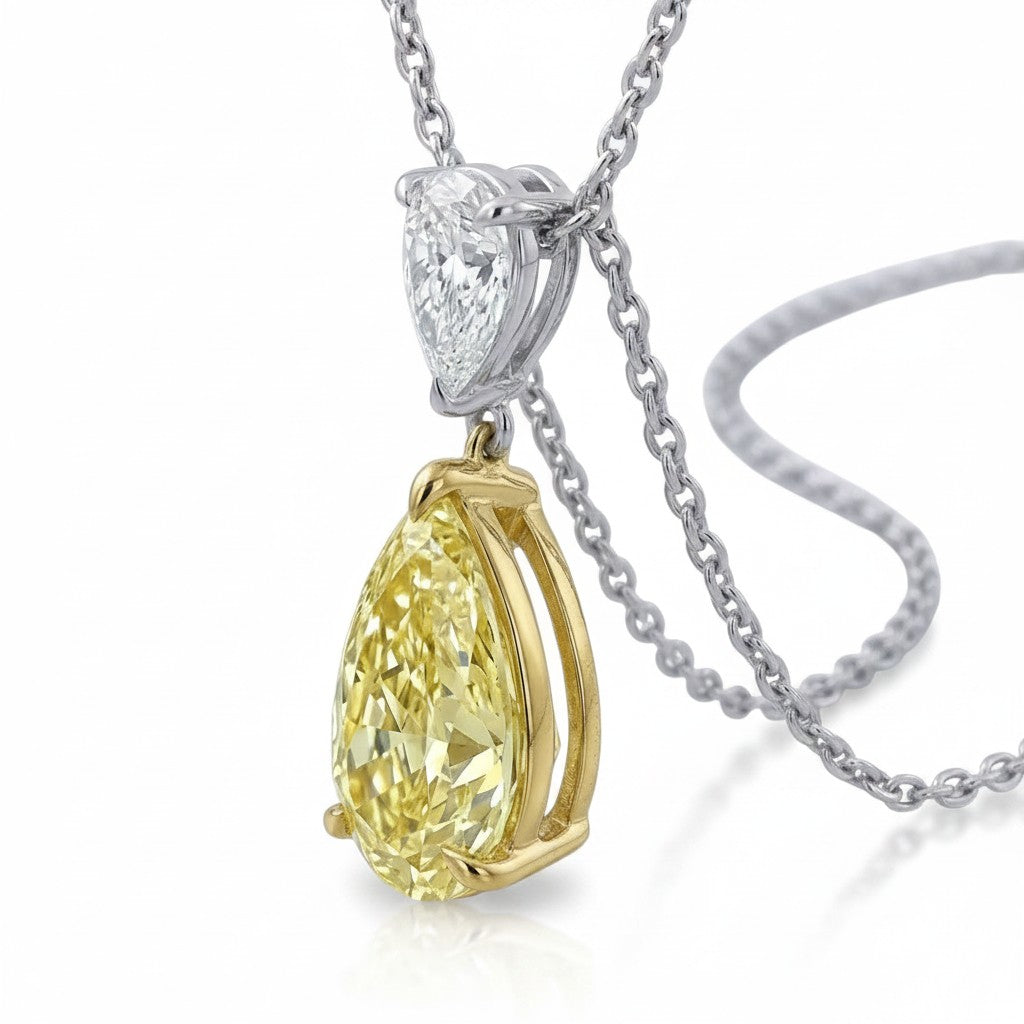 My Store 4 fancy yellow pear-cut diamond pendant necklace with a white pear-cut diamond bail in 18K gold.