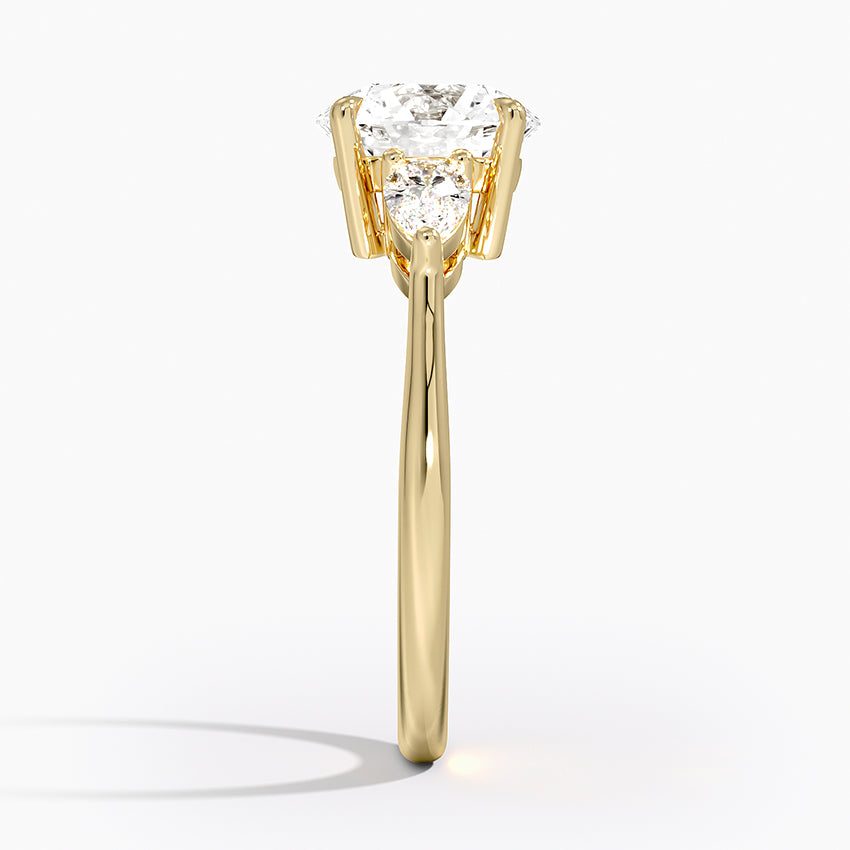 Round Cut Three-Stone Engagement Ring with Pear Side Accents in Solid Gold⁠