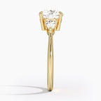 Round Cut Three-Stone Engagement Ring with Pear Side Accents in Solid Gold⁠