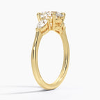 Round Cut Three-Stone Engagement Ring with Pear Side Accents in Solid Gold⁠